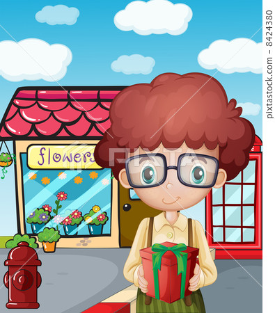 A boy holding a gift in front of the flower shop 8424380