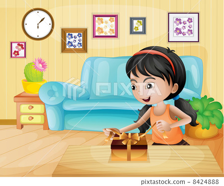 A lady opening her gift in the living room A lady opening her gift in the living room 8424888
