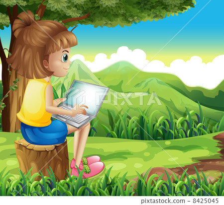 A girl surfing the net at the forest A girl surfing the net at the forest 8425045
