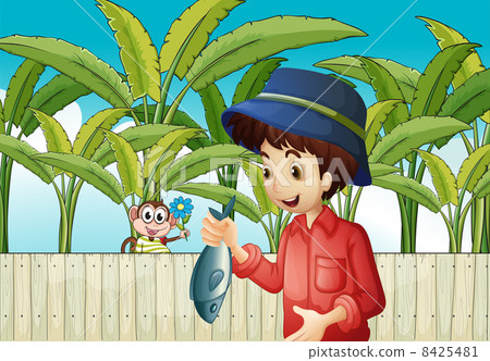 A fisherman holding a fish A fisherman holding a fish 8425481