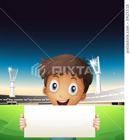 A boy at the stadium holding an empty cardboard A boy at the stadium holding an empty cardboard 8425518