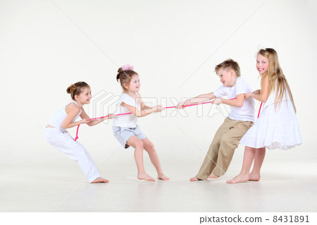 Four happy little boy and girls in white clothes draw over pink Four happy little boy and girls in white clothes draw over pink 8431891