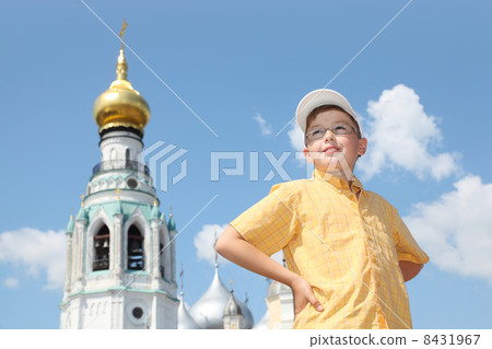 Little boy near Holy Resurrection cathedral in Vologda, Russia 8431967