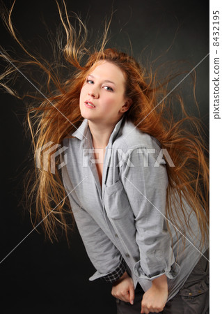 Brown hair woman pose in shirt with hair fluttering in wind in photo studio, half body Brown hair woman pose in shirt with hair fluttering in wind in photo studio, half body 8432195