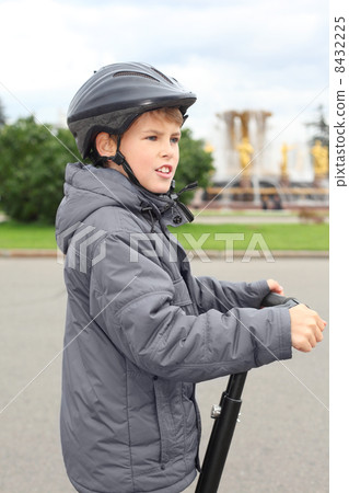 Little boy ride on segway near friendship fountain in Moscow, Russia, side 8432225