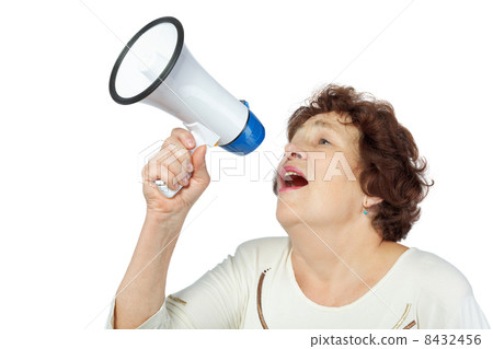 Elderly woman shouts something into a megaphone 8432456