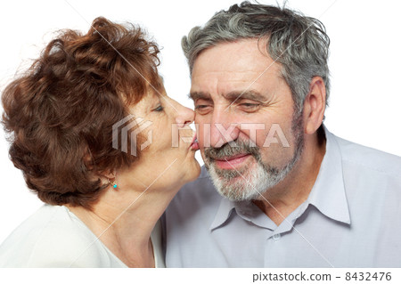 Elderly woman kisses her husband 8432476