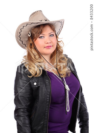Beautiful woman wearing cowboy hat and leather jacket isolated o 8433200