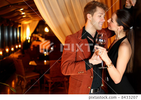 to a good girl flirting young man with a glass of wine to a good girl flirting young man with a glass of wine 8433207