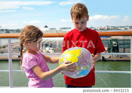 brother and sister travel on ship and hold inflatable globe brother and sister travel on ship and hold inflatable globe 8433215