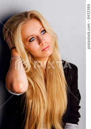 Portrait of a dreamy beautiful woman with blonde hair Portrait of a dreamy beautiful woman with blonde hair 8433369