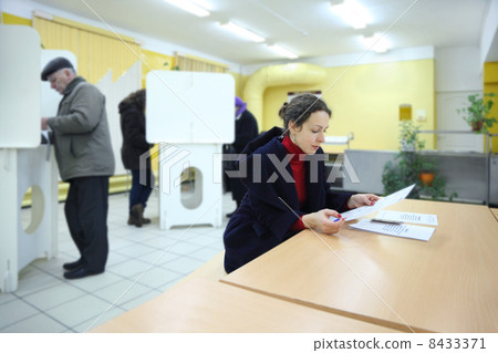 MOSCOW - DECEMBER 4: People casting ballots on elections to Stat MOSCOW - DECEMBER 4: People casting ballots on elections to Stat 8433371