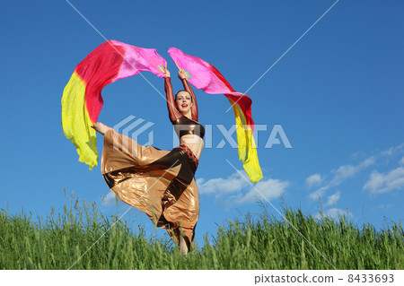 Singing woman wearing beautiful suit dances with pink veil fans Singing woman wearing beautiful suit dances with pink veil fans 8433693