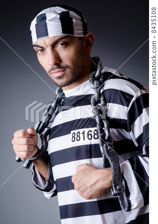 Convict criminal in striped uniform 8435108