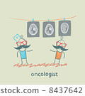 oncologist shows the x-ray images of the patient 8437642