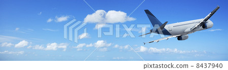 Jet cruising in a blue sky Jet cruising in a blue sky 8437940