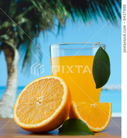 orange juice on a beach 8437986