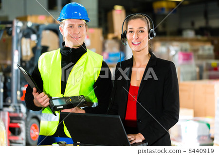 Coworkers at warehouse of forwarding company 8440919