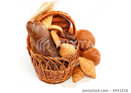 Fresh bread with ears of wheat on a wooden table. Fresh bread with ears of wheat on a wooden table. 8441838
