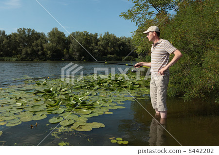 Fishing on a river Fishing on a river 8442202