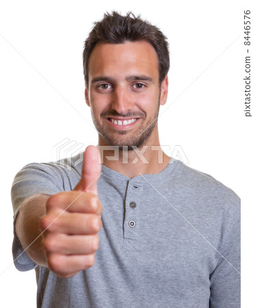 Latin man showing thumb  8446576