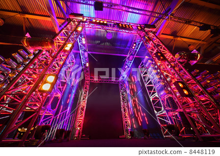 Multi-colored illuminated way to boxing ring inside fight club; 8448119