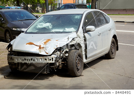 Car after an accident - fallen out radiator, crumpled rusty hood Car after an accident - fallen out radiator, crumpled rusty hood 8448491