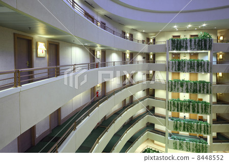 Lot of stories in large hotel, green ivy on balconies, rows of d Lot of stories in large hotel, green ivy on balconies, rows of d 8448552