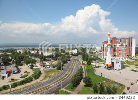 MOSCOW - JUL 09: Cars move near Samara space museum on Jul 09, 2011 in Moscow, Russia. Carrier-rocket "Soyuz" - the main attraction of the museum. 8449228