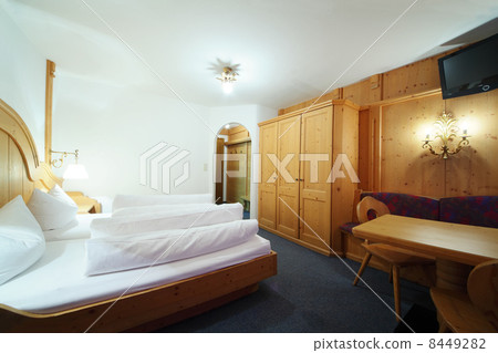 SOLDEN- FEBRUARY 11: Wooden bed in hotel room on February 11, 20 SOLDEN- FEBRUARY 11: Wooden bed in hotel room on February 11, 20 8449282