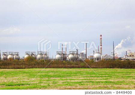 Industrial zone with factories and pipes with smoke and illumina Industrial zone with factories and pipes with smoke and illumina 8449400