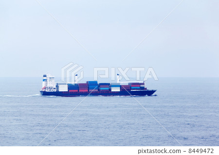 Large cargo ship floats in open ocean, many containers stand at Large cargo ship floats in open ocean, many containers stand at 8449472