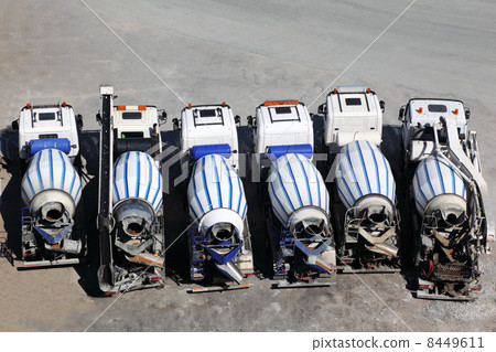 Six concrete mixer machines stand on asphalt at sunny day; back Six concrete mixer machines stand on asphalt at sunny day; back 8449611