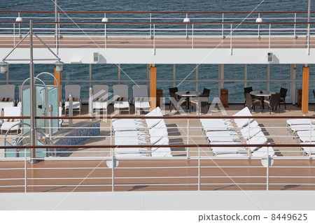 top floor of ship with deck chairs showers 8449625