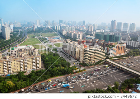 Modern skyscrapers and many cars on highway in Guangzhou, China. 8449672