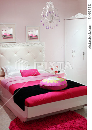 Stylish white-pink bedroom with white wardrobe and pink carpet. 8449818