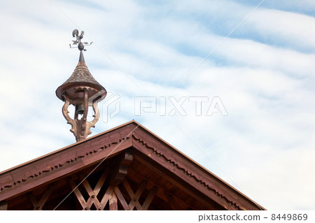 Fragment of wooden roof with weathercock 8449869