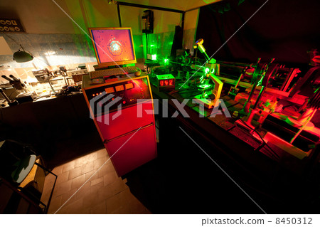 Movement of microparticles by laser in dark lab with timer, monitor, mouse, keyboard 8450312