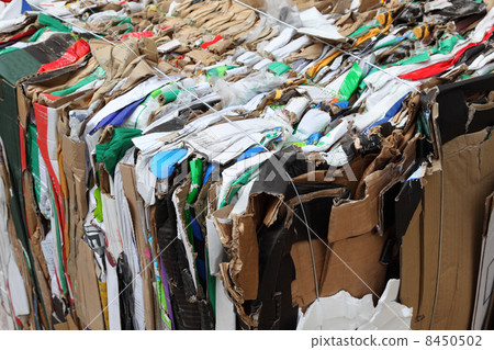 big pressed boxes made of paperboard prepared for recycling 8450502
