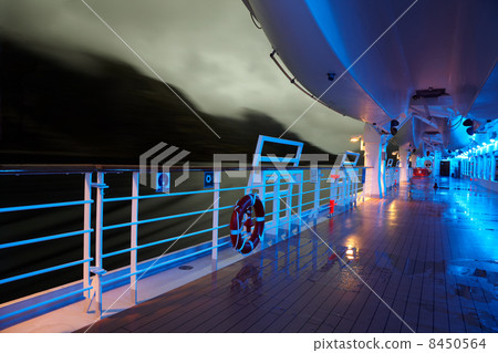 Deck with lifeboats in evening light 8450564