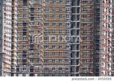 Construction of new building with workers 8450569