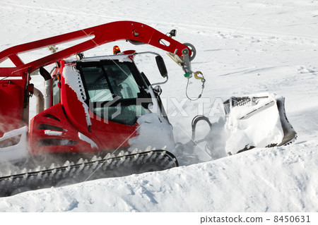 .Snow-grooming machine on snow hill .Snow-grooming machine on snow hill 8450631