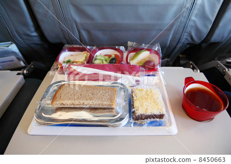 One serving on tray of packed food at airplane. Focus on bread. One serving on tray of packed food at airplane. Focus on bread. 8450663