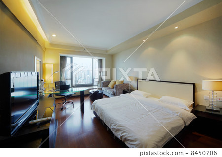 Big double soft bed with white linen, tv and table in stylish li Big double soft bed with white linen, tv and table in stylish li 8450706