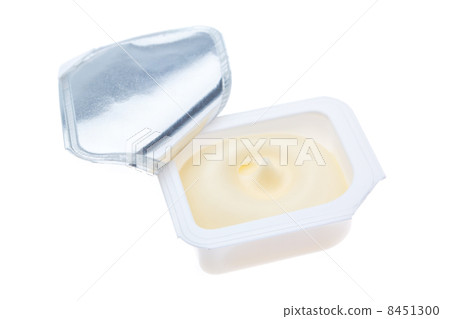 Open plastic packages of butter. On a white background. Open plastic packages of butter. On a white background. 8451300