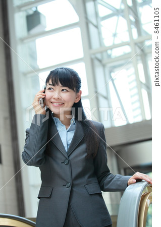 Business woman who climbed the escalator Business woman who climbed the escalator 8461105