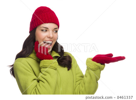 Mixed Race Woman Wearing Hat and Gloves Gesturing to Side Mixed Race Woman Wearing Hat and Gloves Gesturing to Side 8461337