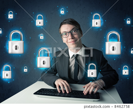 Stock Photo: Young hacker with virtual lock symbols and icons