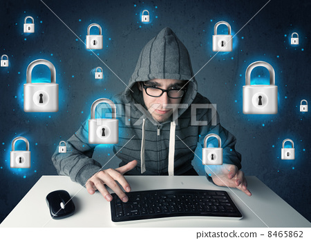 Stock Photo: Young hacker with virtual lock symbols and icons