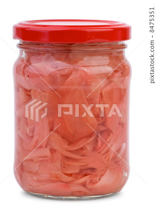 Sliced ginger root marinated in the glass jar 8475351